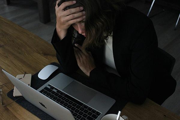 Person overwhelmed by multiple apps and messages